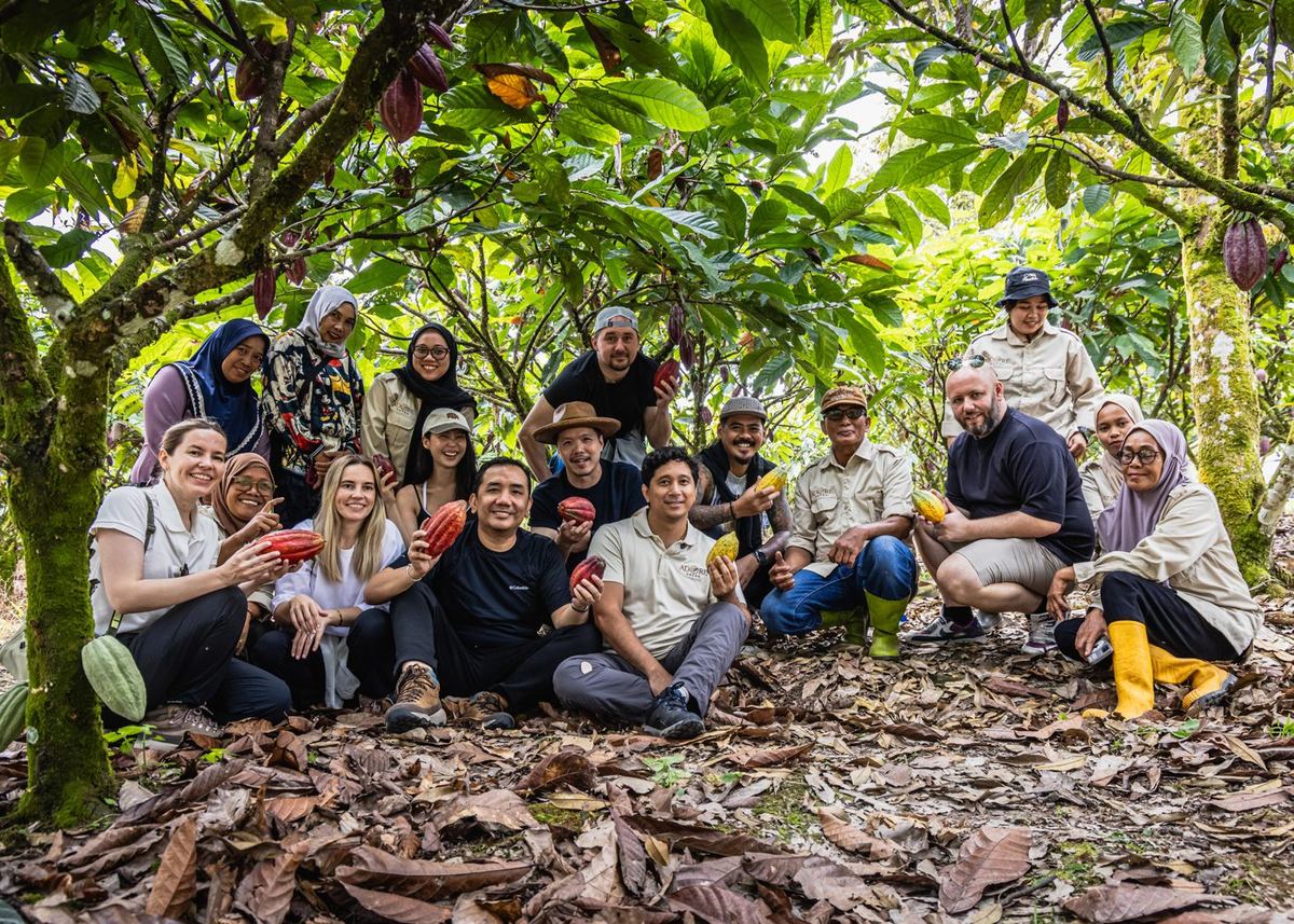 Farmers and processing teams working with Adore